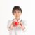 Beautiful Attractive Asian doctor woman with stethoscope holding document smile and showing red heart for good health feeling so happiness and confident,Isolated on white background,Healthcare Concept