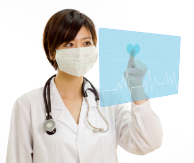 Asian doctor pressing heart button on virtual interface-1