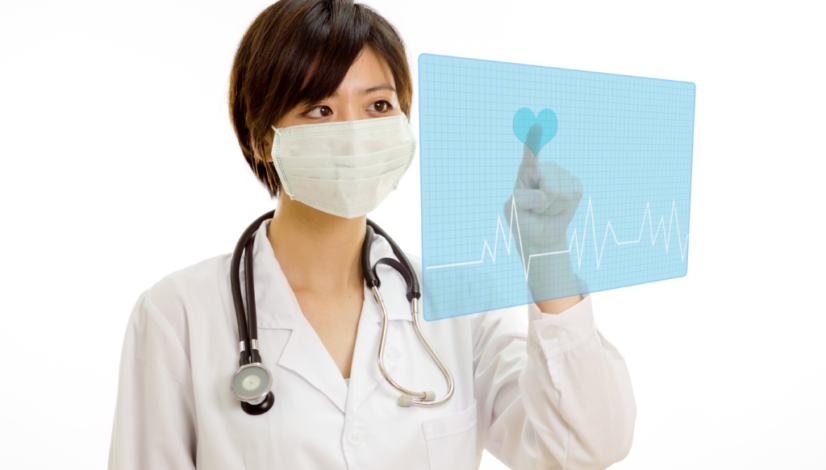Asian doctor pressing heart button on virtual interface-1
